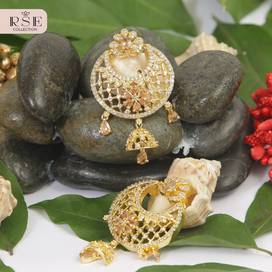 Designer Gold Plated Jhumka Earrings with Floral Motif